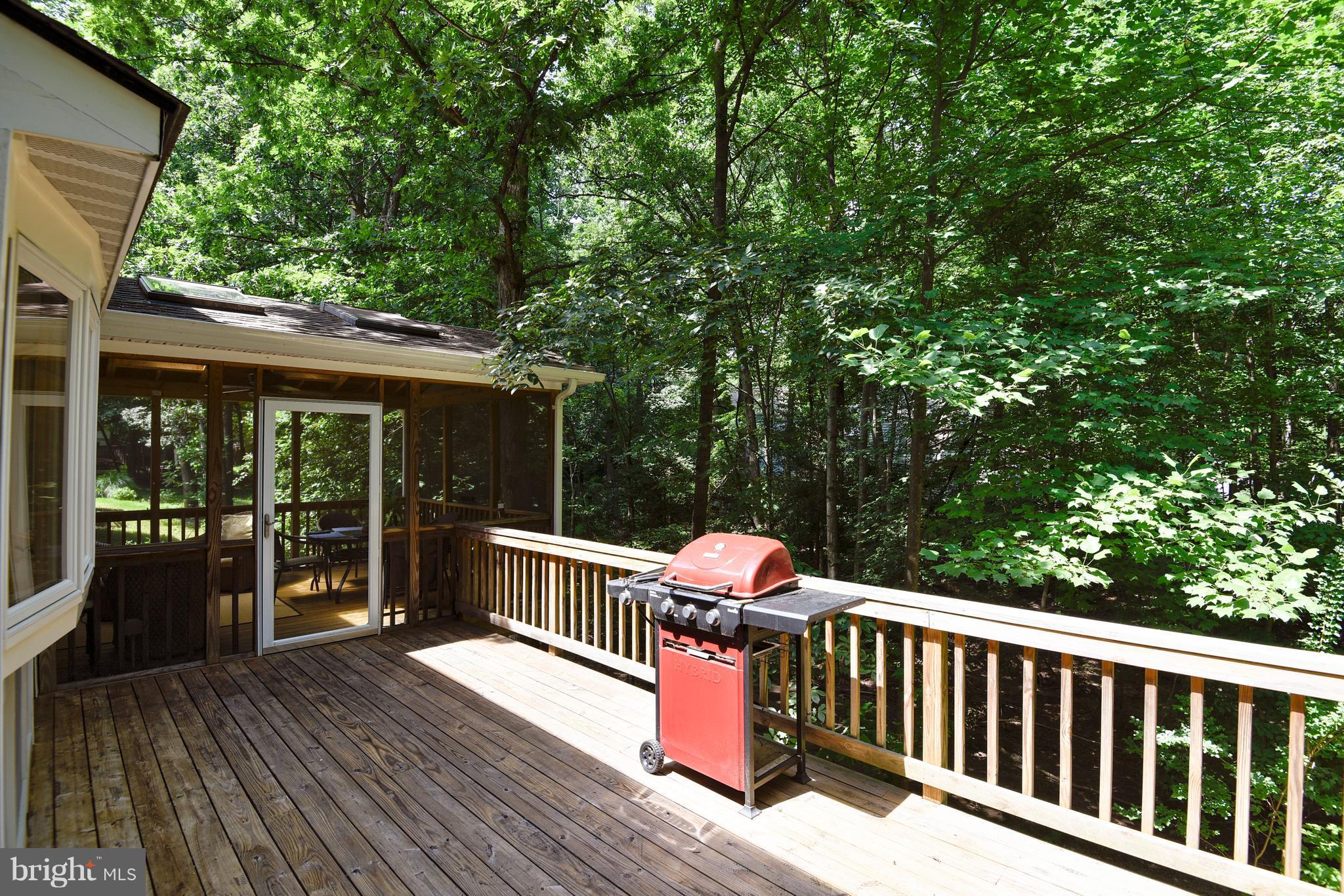 11692 Bennington Woods Road Reston, VA 20194 - Photo 8 of 29 a view of a two chairs and table in the deck