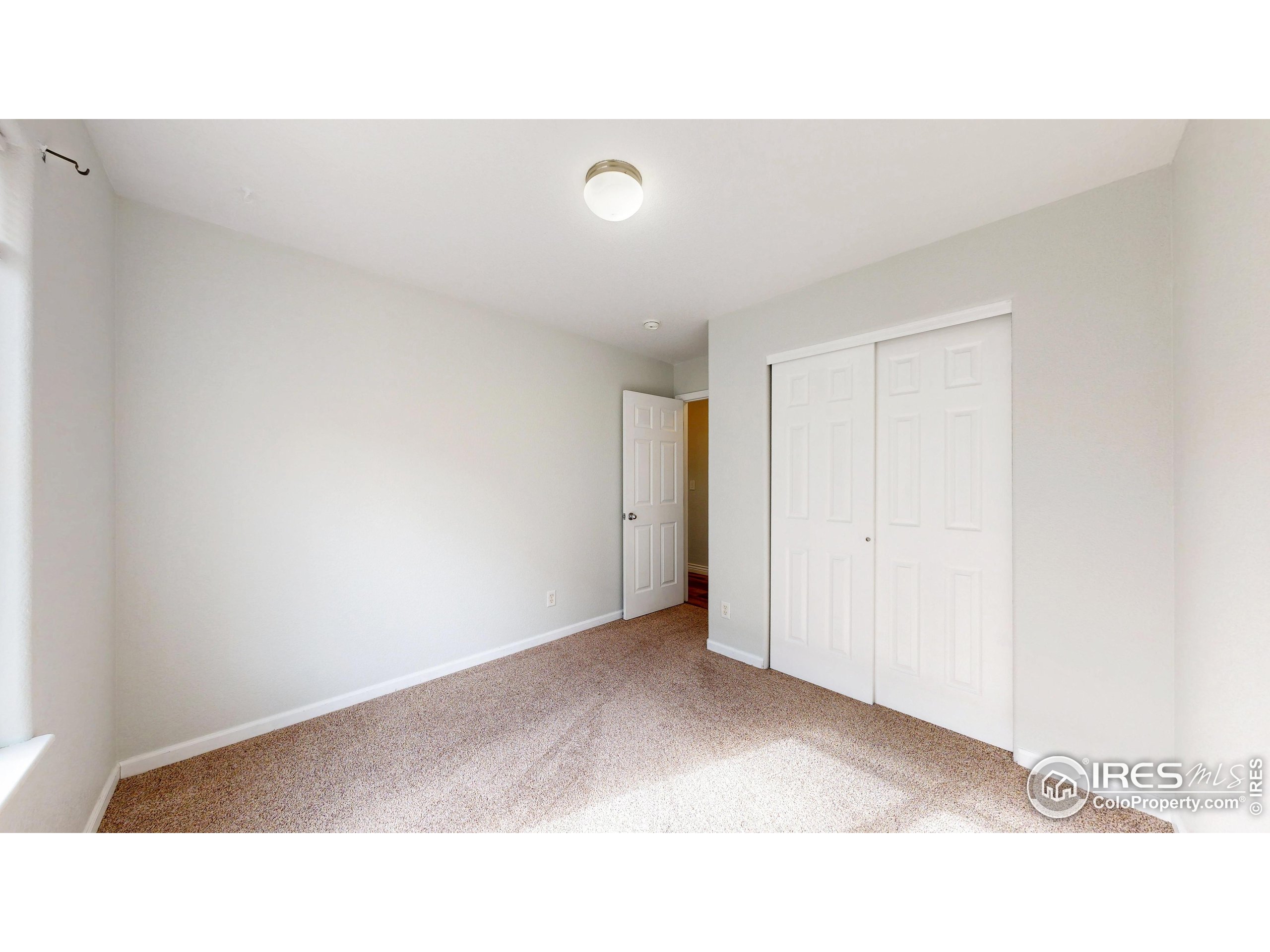 315 Coal Ridge Drive Frederick, CO 80530 - Photo 14 of 25 a open hall with a white wall