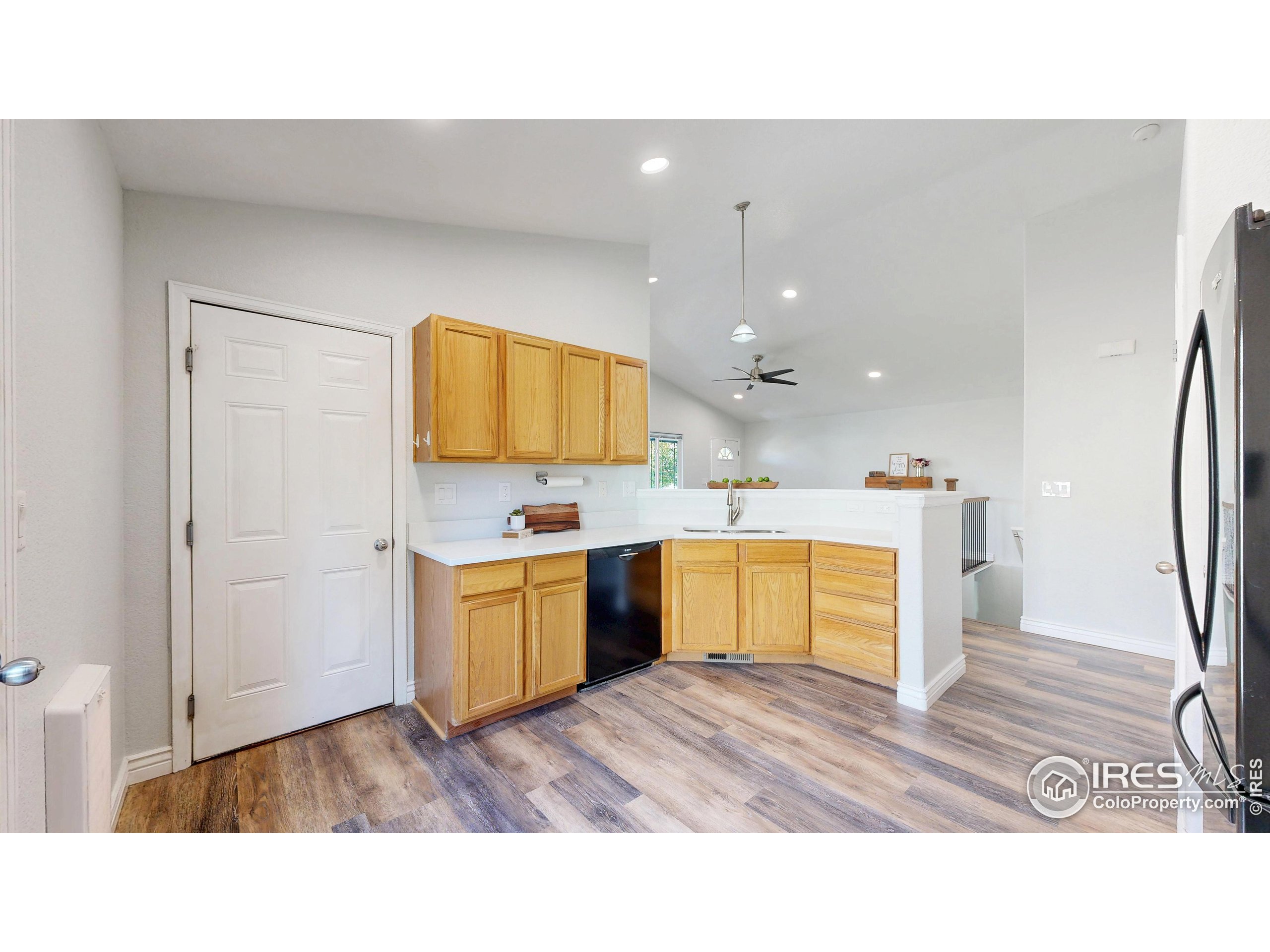 315 Coal Ridge Drive Frederick, CO 80530 - Photo 4 of 25 a kitchen with a sink window and stainless steel appliances