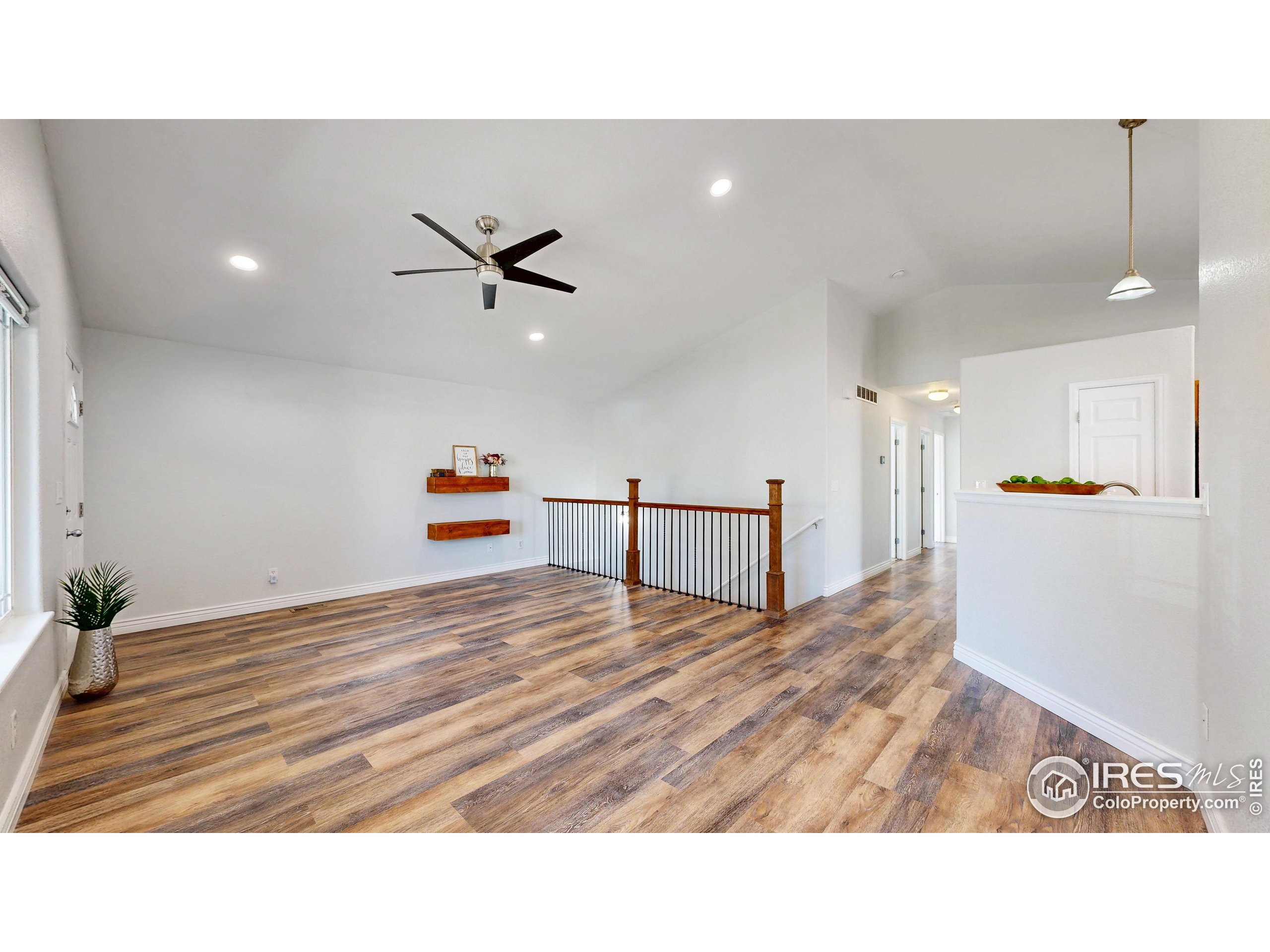 315 Coal Ridge Drive Frederick, CO 80530 - Photo 6 of 25 a living room with furniture and kitchen view