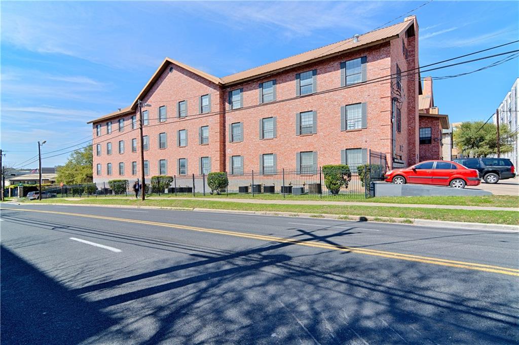 a view of a parked cars in front of a building