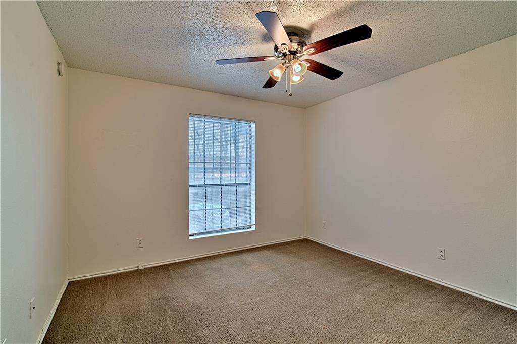2401 Leon Street, Unit 104 Austin, TX 78705 - Photo 11 of 21 an empty room with windows and fan
