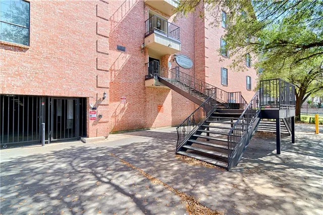 a view of a house with wooden stairs