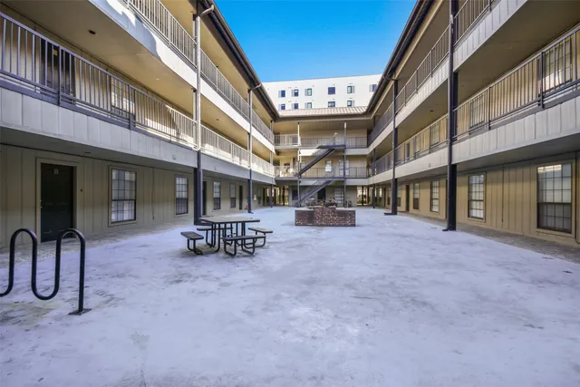 a view of a building with sitting area