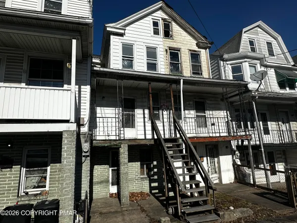 a front view of residential houses with street
