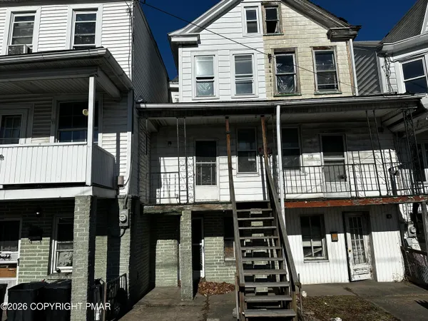 a front view of a house with balcony