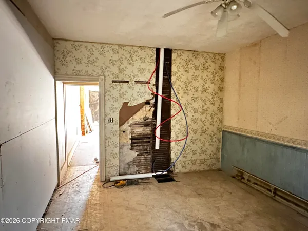a view of an entryway with wooden floor