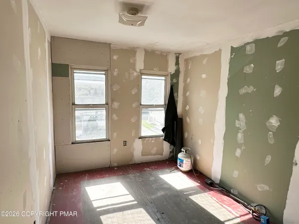 a view of an empty room and window