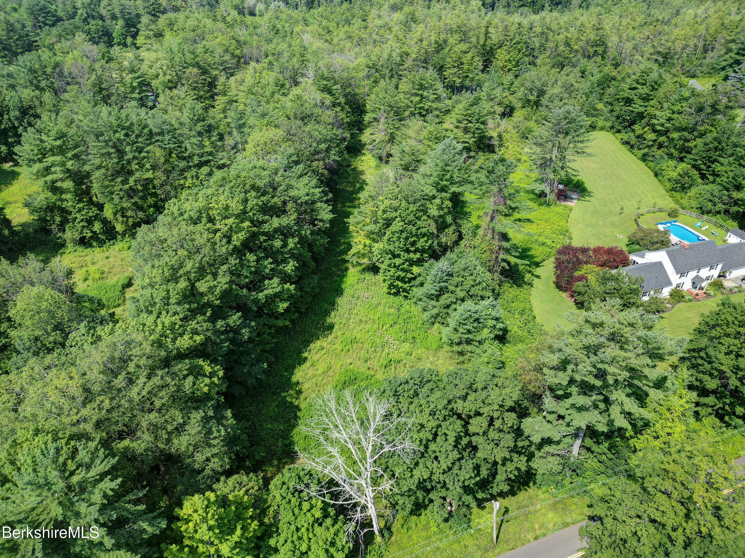 235 Spring Street Lee, MA 01238 - Photo 4 of 5 an aerial view of residential house with outdoor space and trees all around