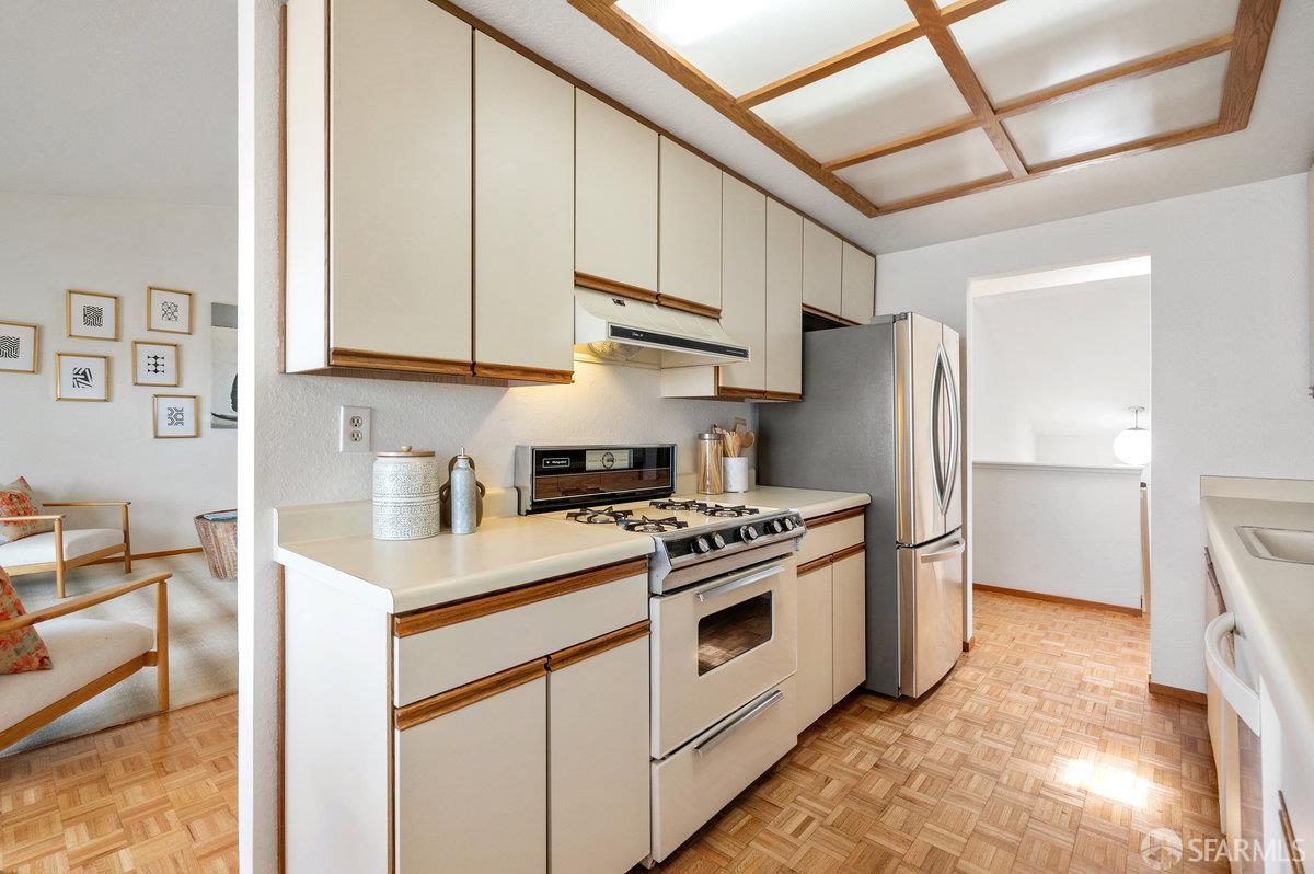 200 Bayview Circle San Francisco, CA 94124 - Photo 17 of 50 a kitchen with stainless steel appliances granite countertop a stove a refrigerator and a refrigerator