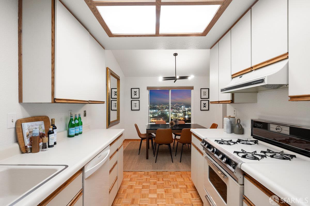 200 Bayview Circle San Francisco, CA 94124 - Photo 18 of 50 a kitchen with a stove and a white cabinets