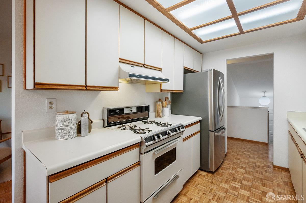 200 Bayview Circle San Francisco, CA 94124 - Photo 19 of 50 a kitchen with stainless steel appliances a stove a sink and a refrigerator