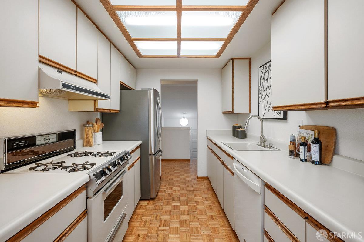 200 Bayview Circle San Francisco, CA 94124 - Photo 20 of 50 a kitchen with stainless steel appliances granite countertop a sink stove and refrigerator