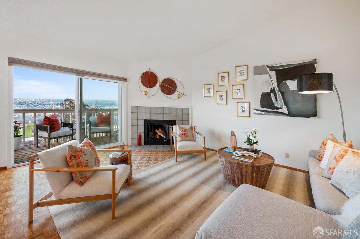 200 Bayview Circle San Francisco, CA 94124 - Photo 2 of 50 a living room with furniture and a fireplace
