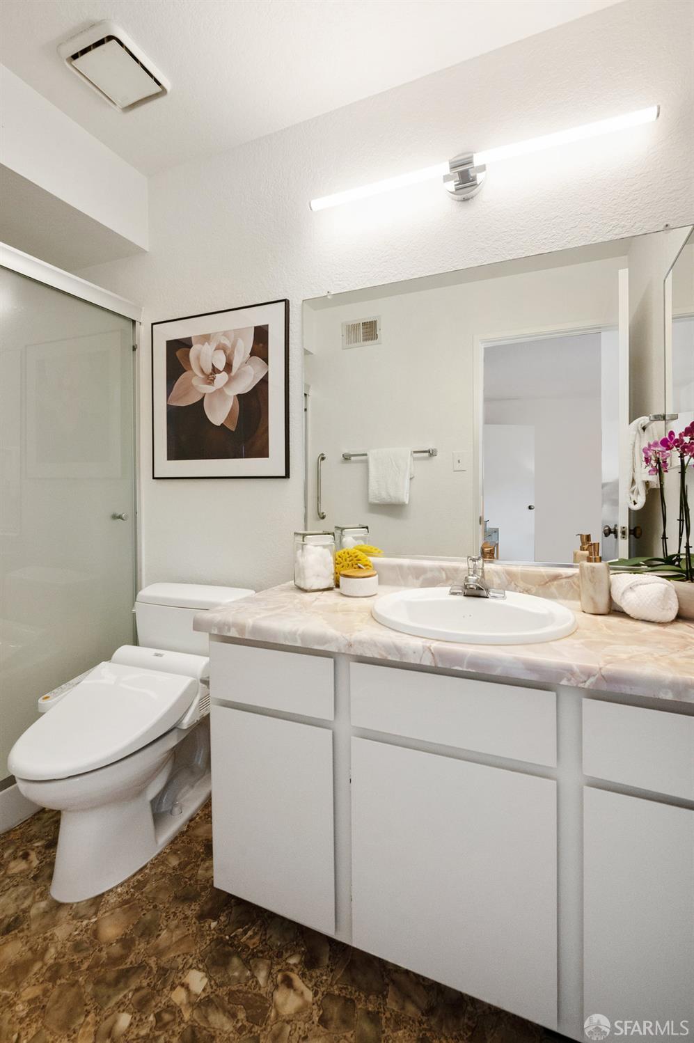 200 Bayview Circle San Francisco, CA 94124 - Photo 24 of 50 a bathroom with a toilet sink and mirror
