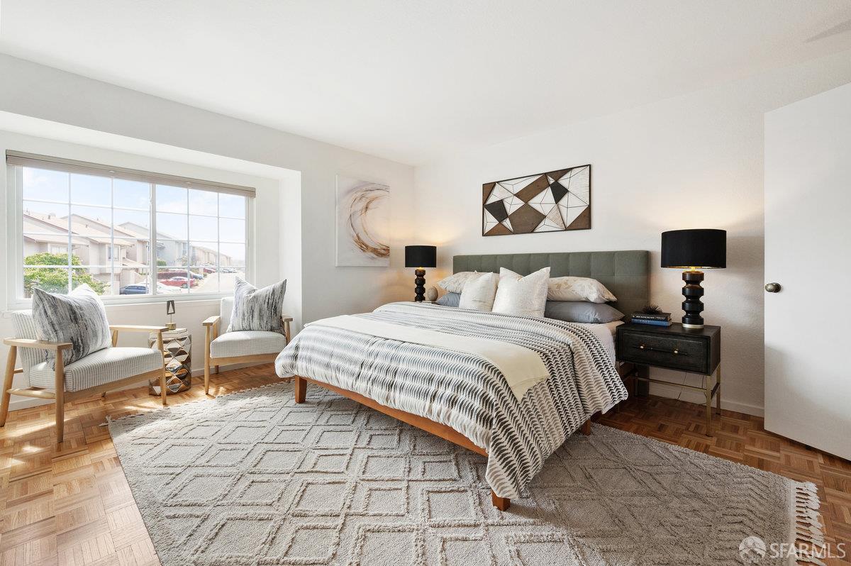 200 Bayview Circle San Francisco, CA 94124 - Photo 30 of 50 a bedroom with a bed and wooden floor