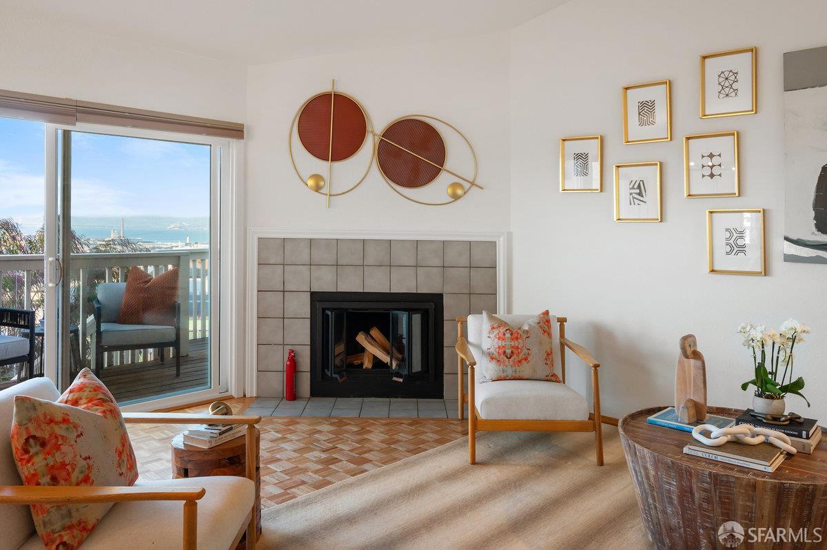 200 Bayview Circle San Francisco, CA 94124 - Photo 3 of 50 a living room with furniture and a fireplace