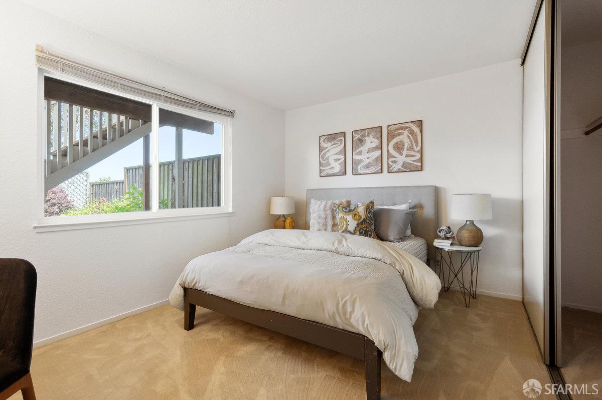 200 Bayview Circle San Francisco, CA 94124 - Photo 35 of 50 a bedroom with a bed and a window