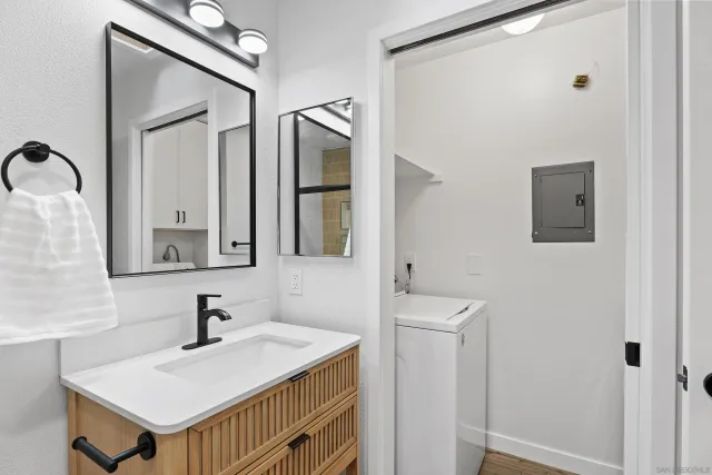 a bathroom with a sink a mirror and a toilet
