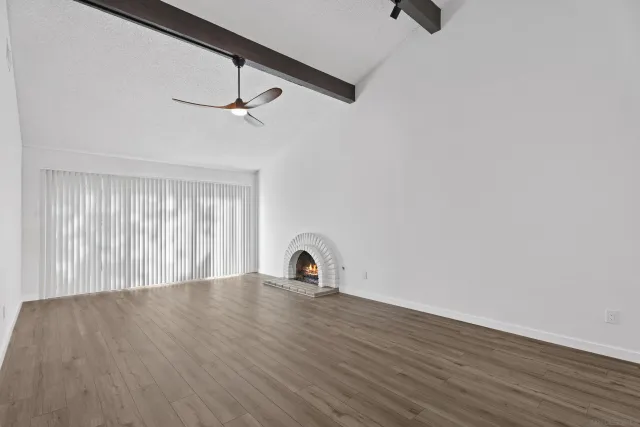 a room with wooden floor and window