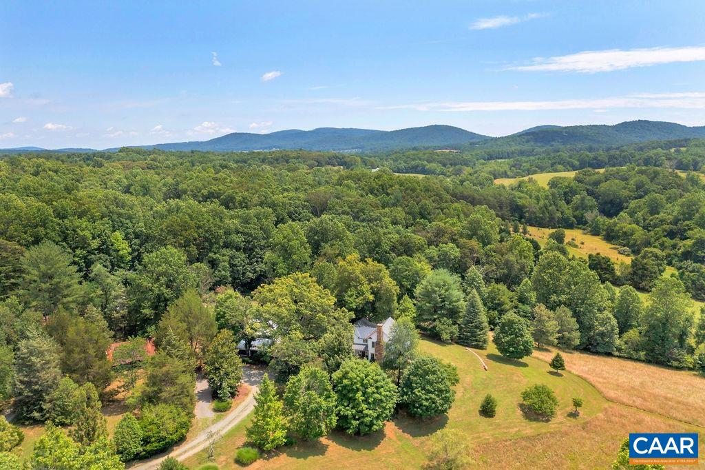 3609 Stony Point Road Charlottesville, VA 22911 - Photo 4 of 58 a view of a lush green hillside and a houses