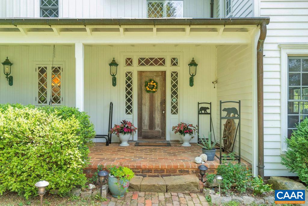 3609 Stony Point Road Charlottesville, VA 22911 - Photo 52 of 58 a front view of a house with potted plants