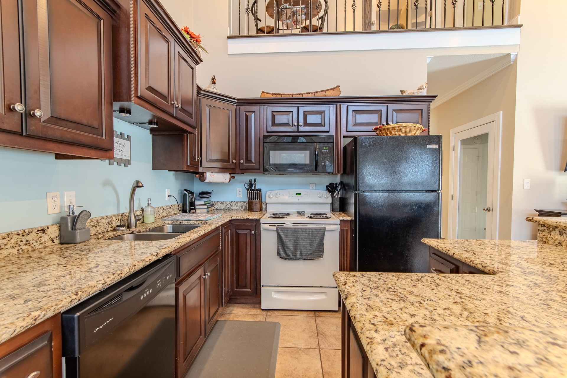 1040 Whites Creek Lane Decaturville, TN 38329 - Photo 25 of 80 a kitchen with stainless steel appliances granite countertop a refrigerator and a sink