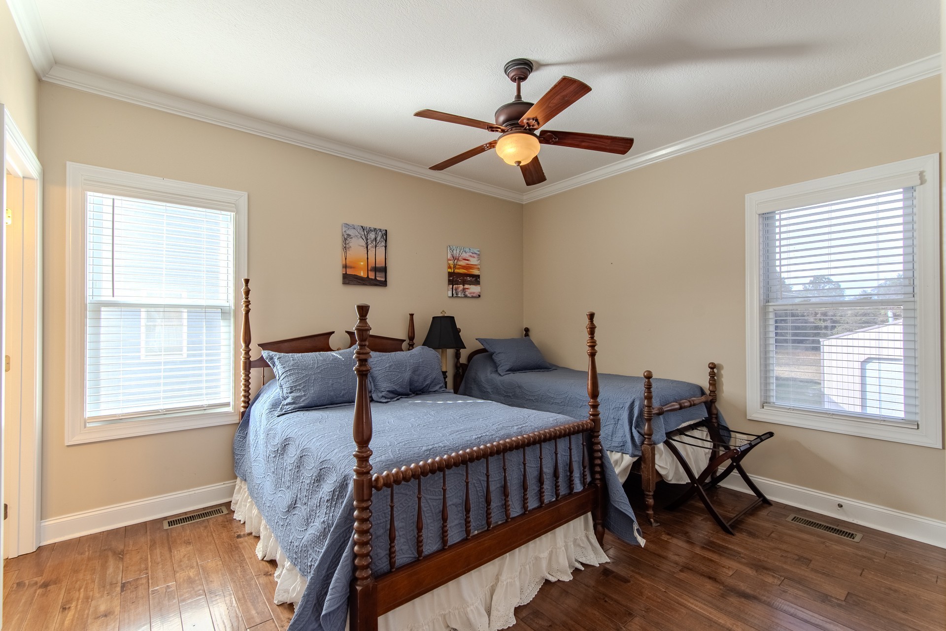 1040 Whites Creek Lane Decaturville, TN 38329 - Photo 36 of 80 a bedroom with a bed and wooden floor