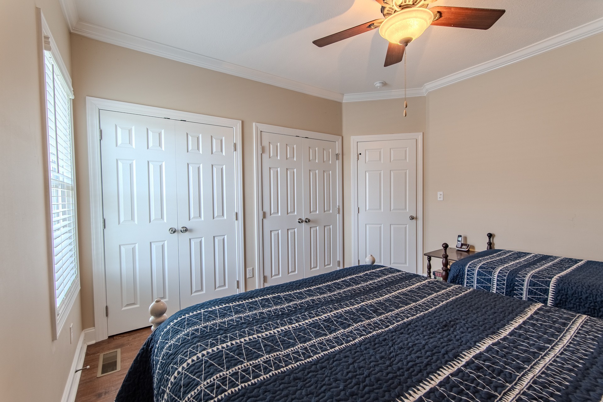 1040 Whites Creek Lane Decaturville, TN 38329 - Photo 38 of 80 a bedroom with two beds and a chandelier