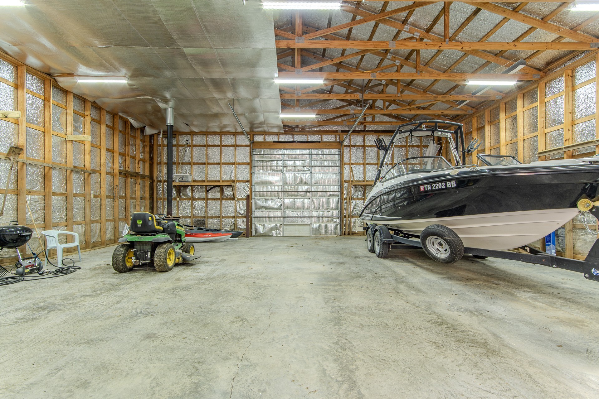 1040 Whites Creek Lane Decaturville, TN 38329 - Photo 54 of 80 a view of parking garage with cars