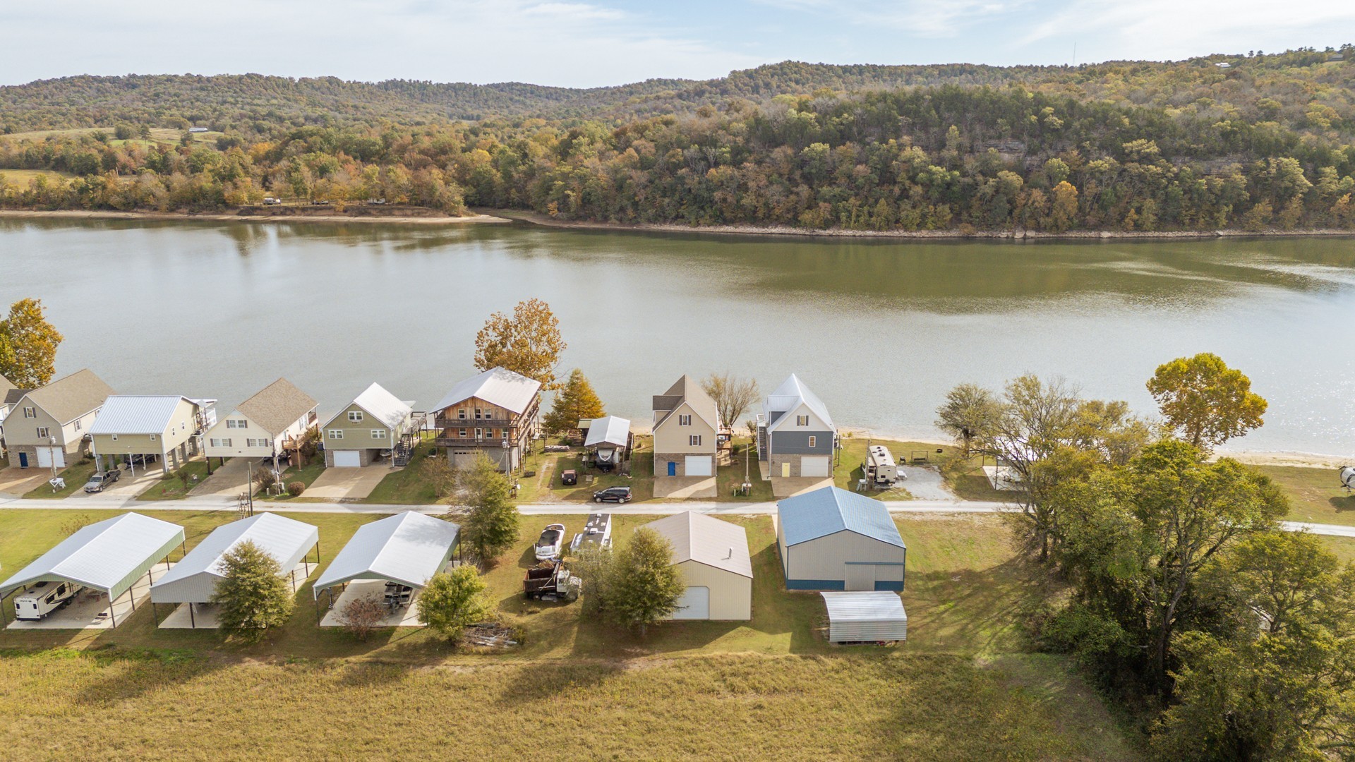 1040 Whites Creek Lane Decaturville, TN 38329 - Photo 60 of 80 a view of a lake with a mountain