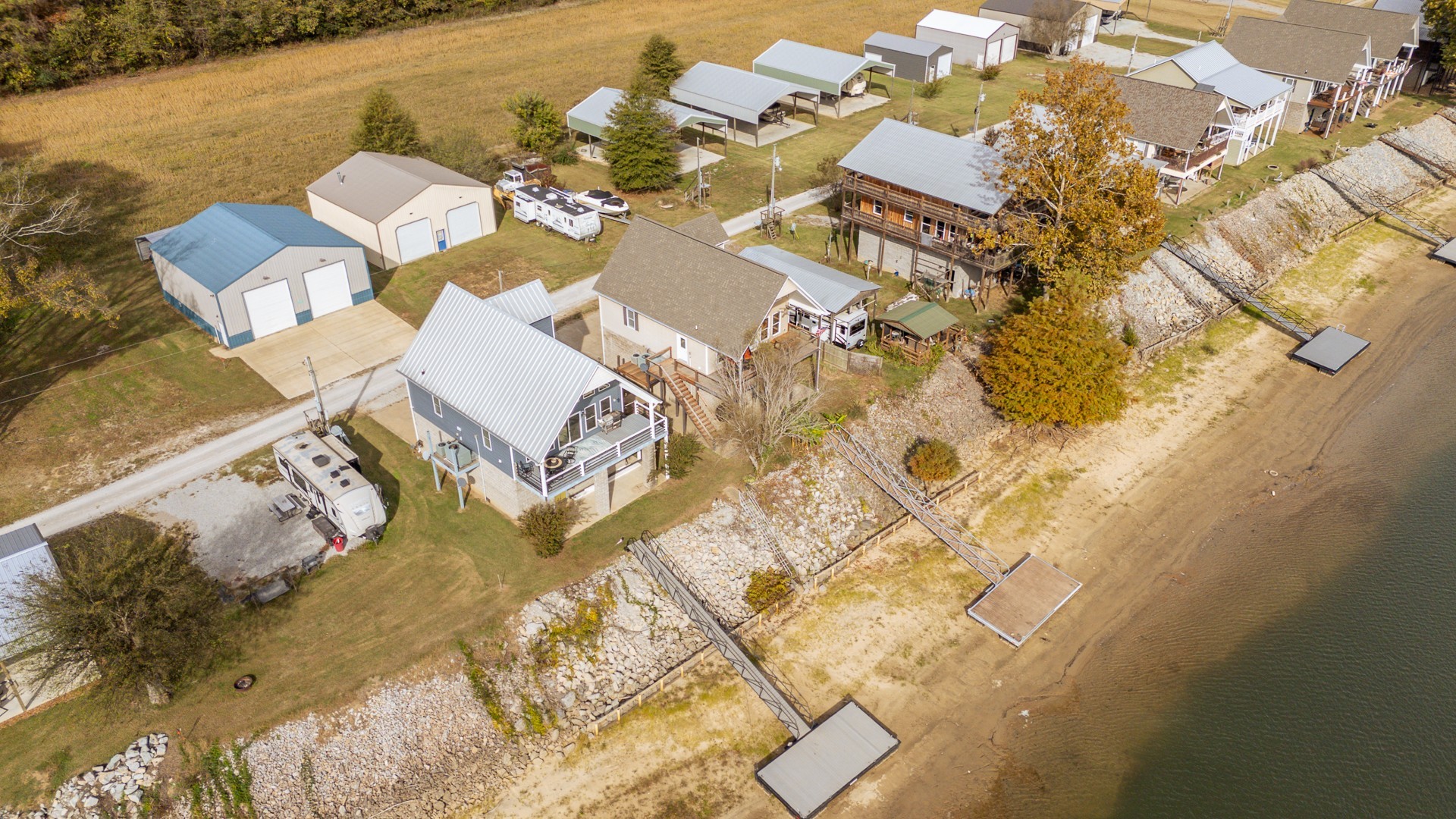 1040 Whites Creek Lane Decaturville, TN 38329 - Photo 65 of 80 an aerial view of residential house with swimming pool and lawn chairs