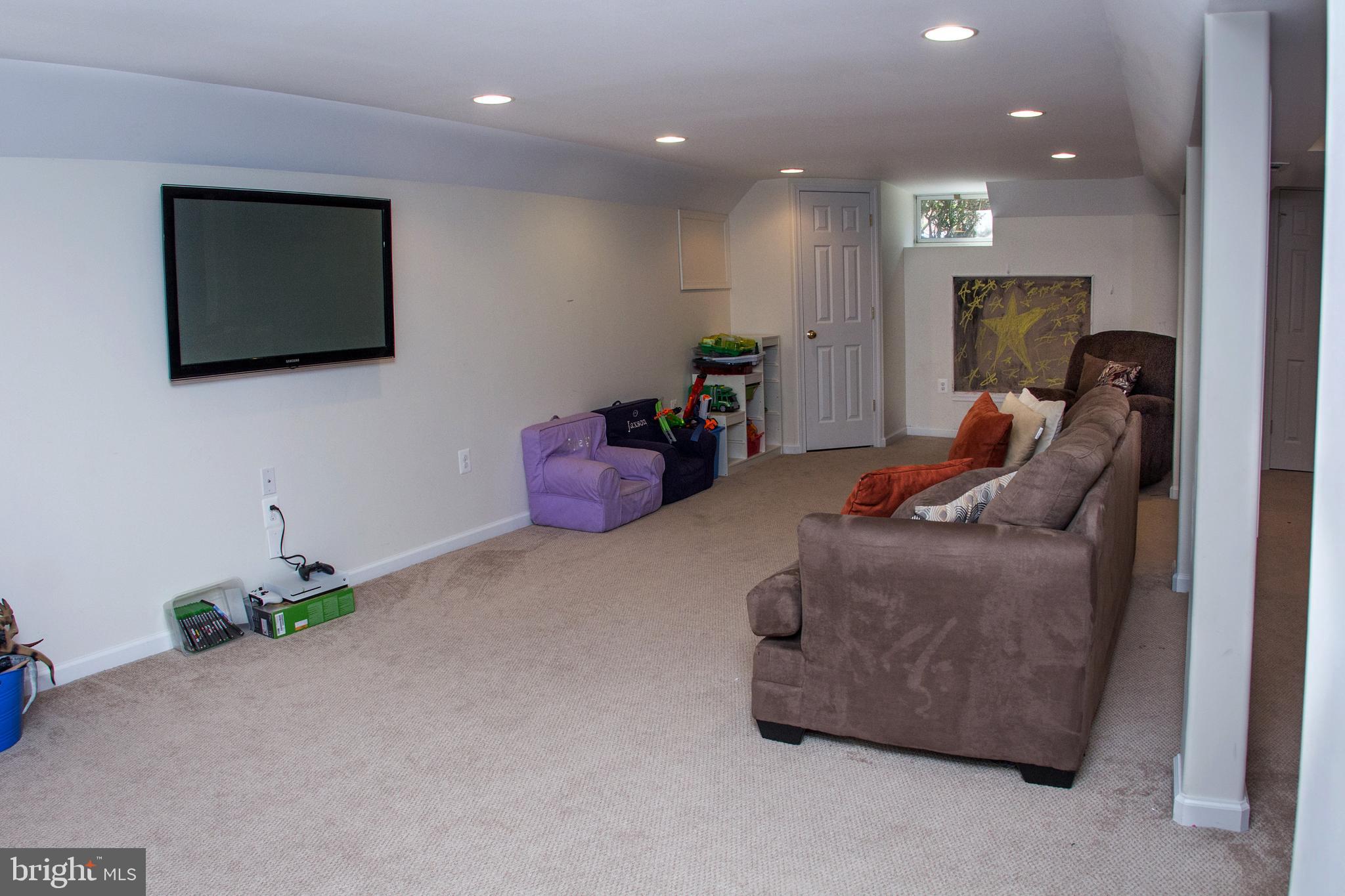 89 Flyatt Road Shamong, NJ 08088 - Photo 22 of 30 a living room with furniture and a flat screen tv