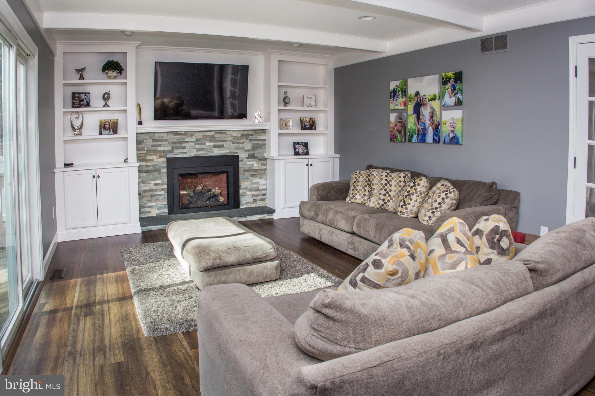 89 Flyatt Road Shamong, NJ 08088 - Photo 8 of 30 a living room with furniture and a fireplace