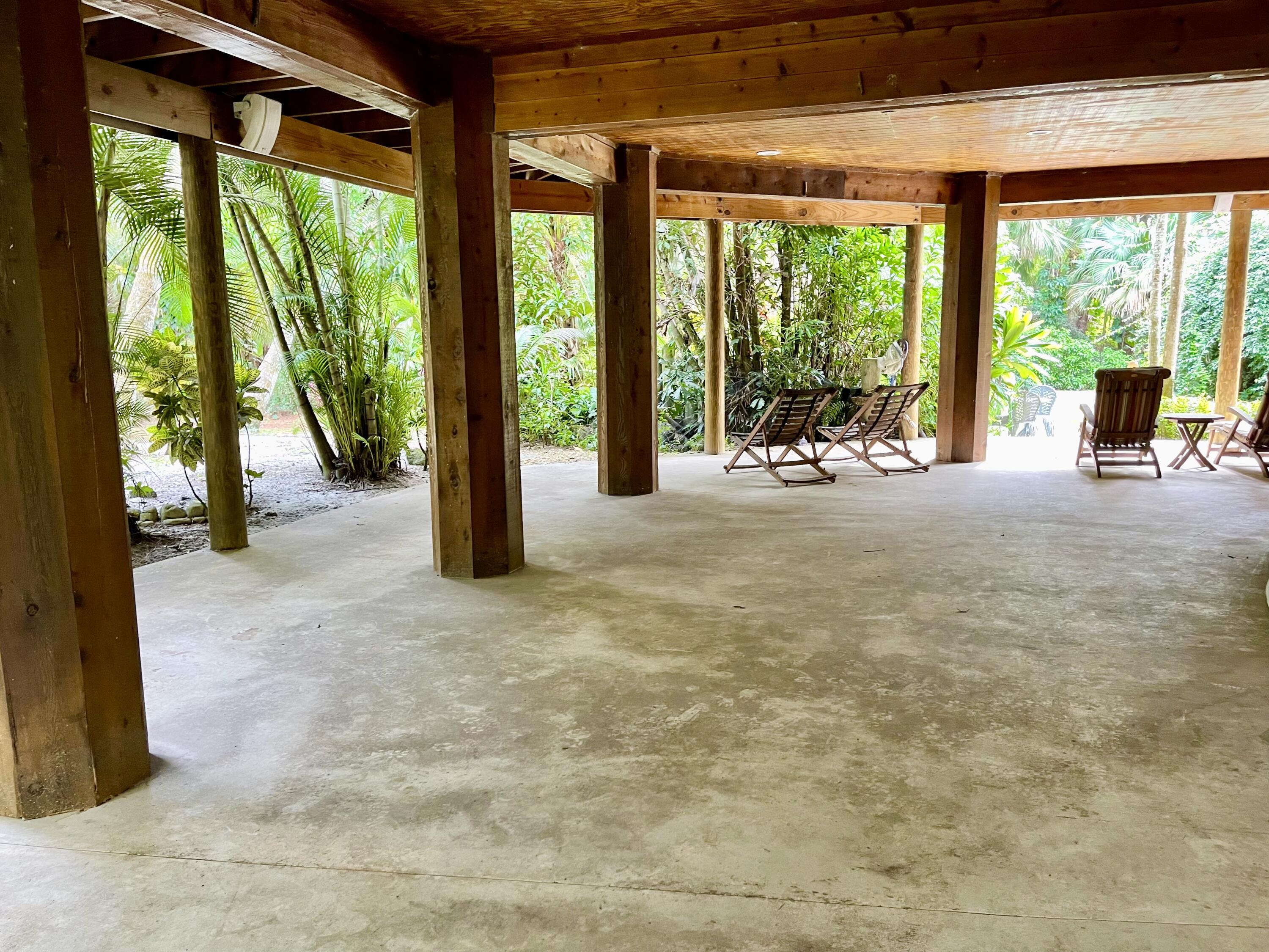 9470 Sandy Run Road Jupiter, FL 33478 - Photo 12 of 48 a view of a room with porch and wooden floor