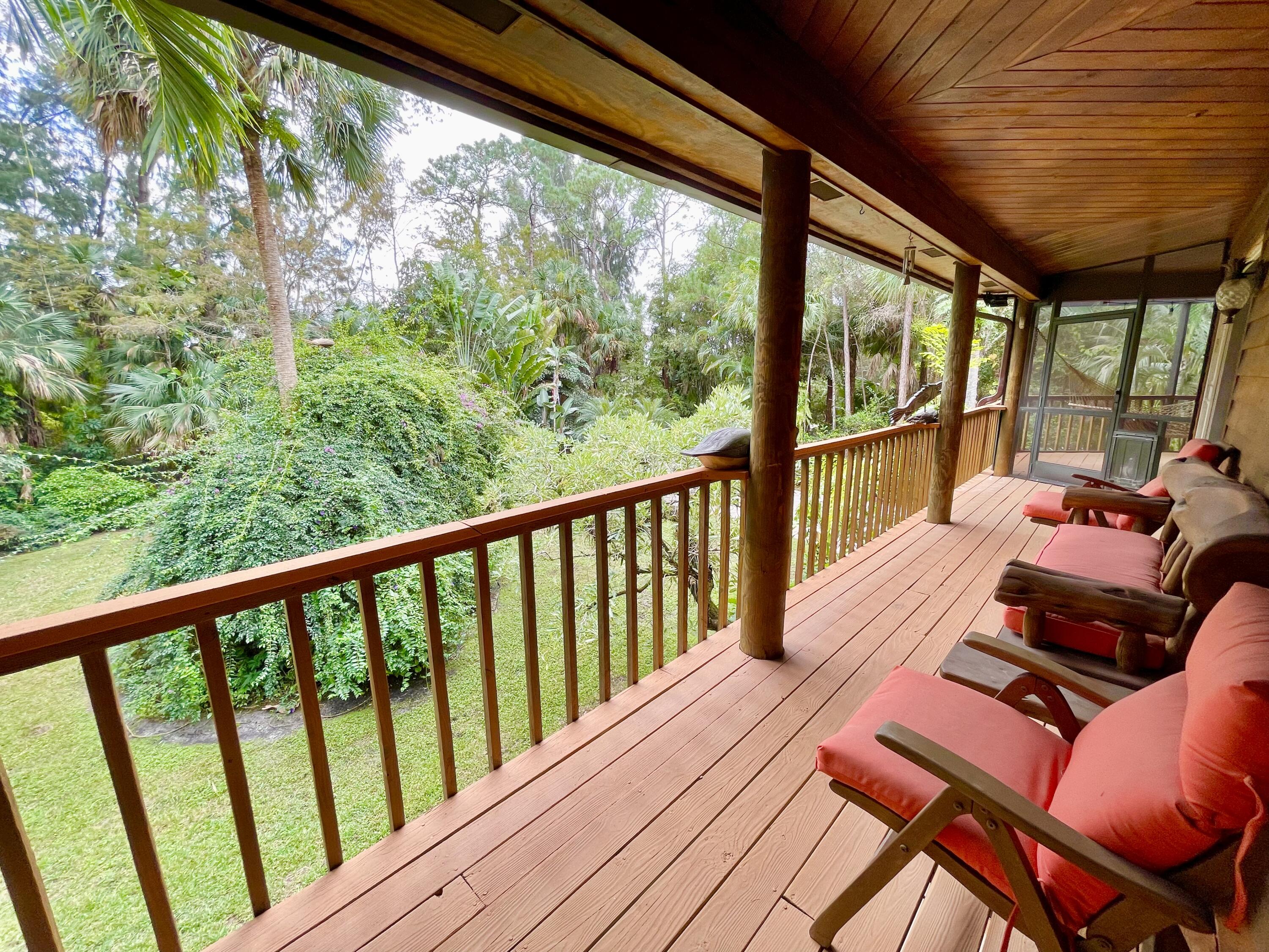 9470 Sandy Run Road Jupiter, FL 33478 - Photo 17 of 48 a view of a patio with wooden floor