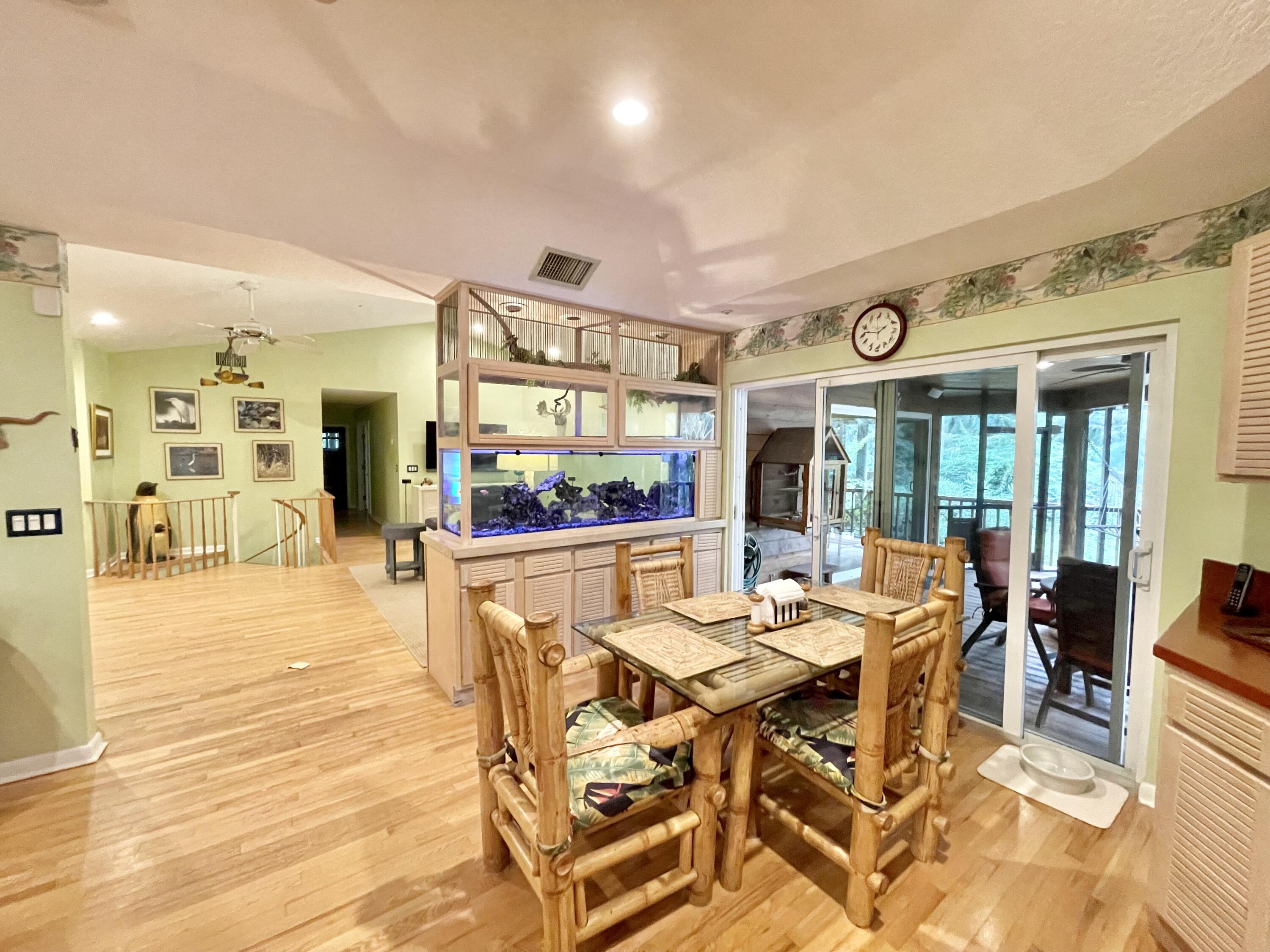 9470 Sandy Run Road Jupiter, FL 33478 - Photo 28 of 48 a outdoor space with lots of table and chairs