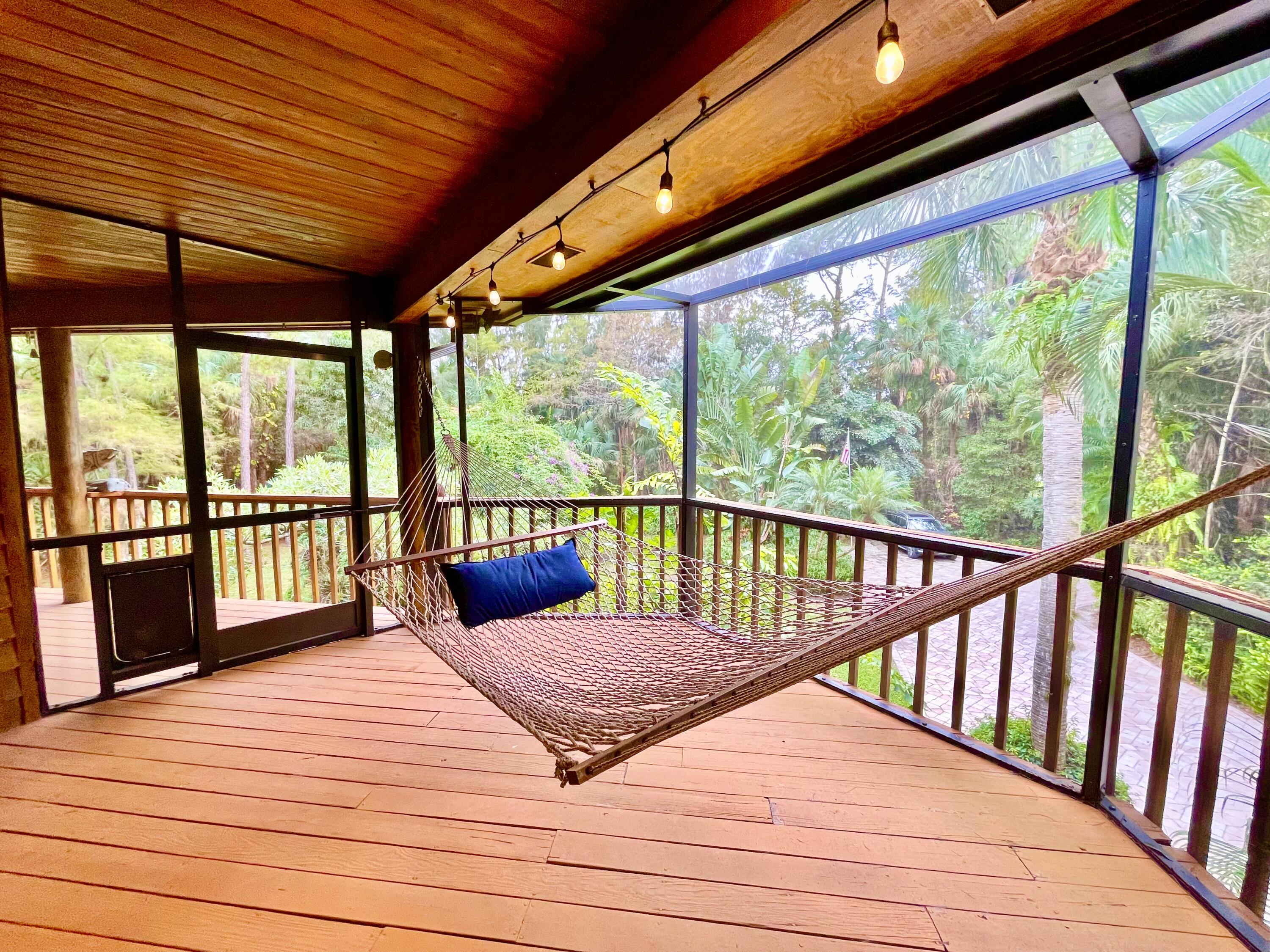 9470 Sandy Run Road Jupiter, FL 33478 - Photo 29 of 48 a balcony with wooden floor