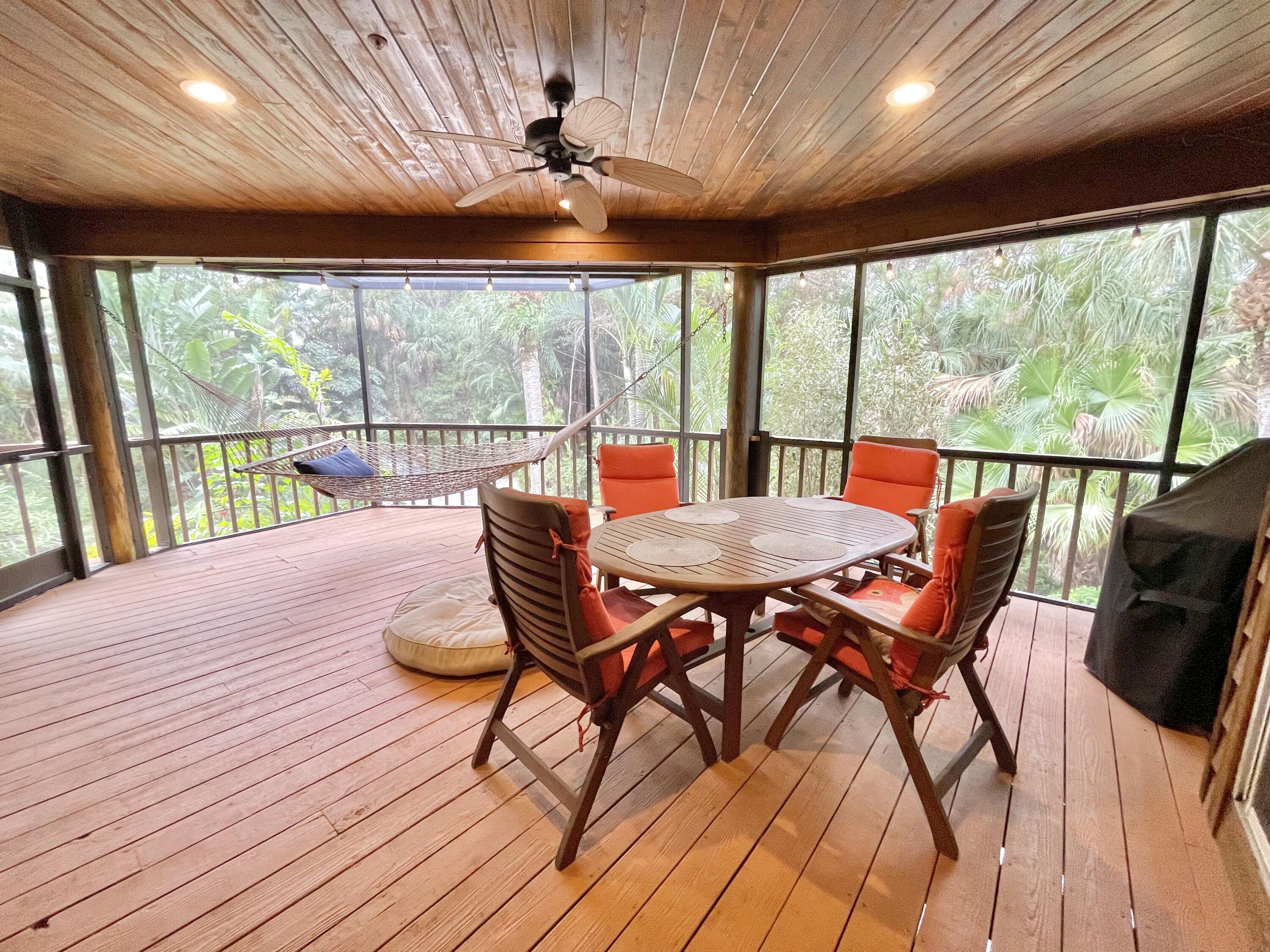 9470 Sandy Run Road Jupiter, FL 33478 - Photo 30 of 48 a view of a dining room with furniture window and outside view