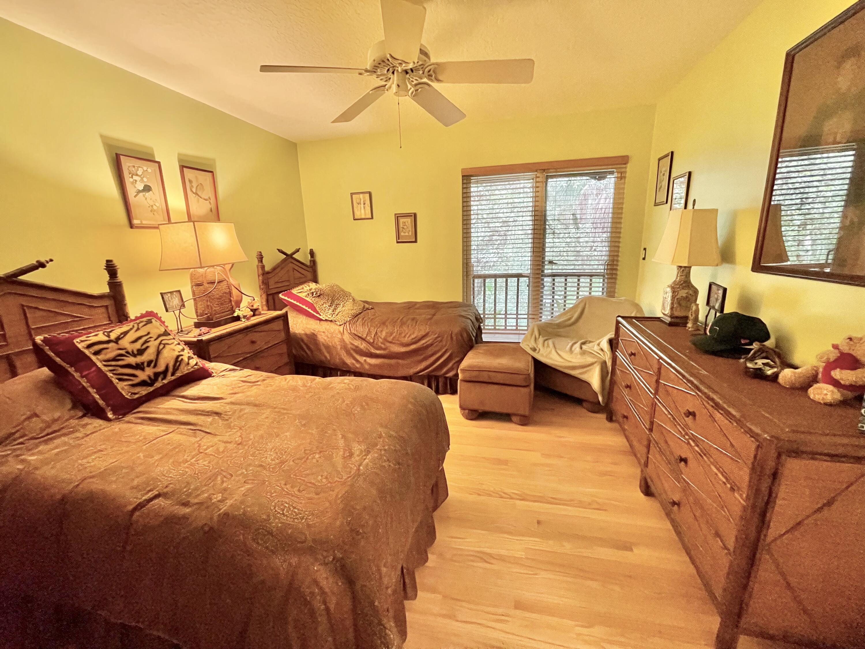 9470 Sandy Run Road Jupiter, FL 33478 - Photo 35 of 48 a bed room with two beds and a window