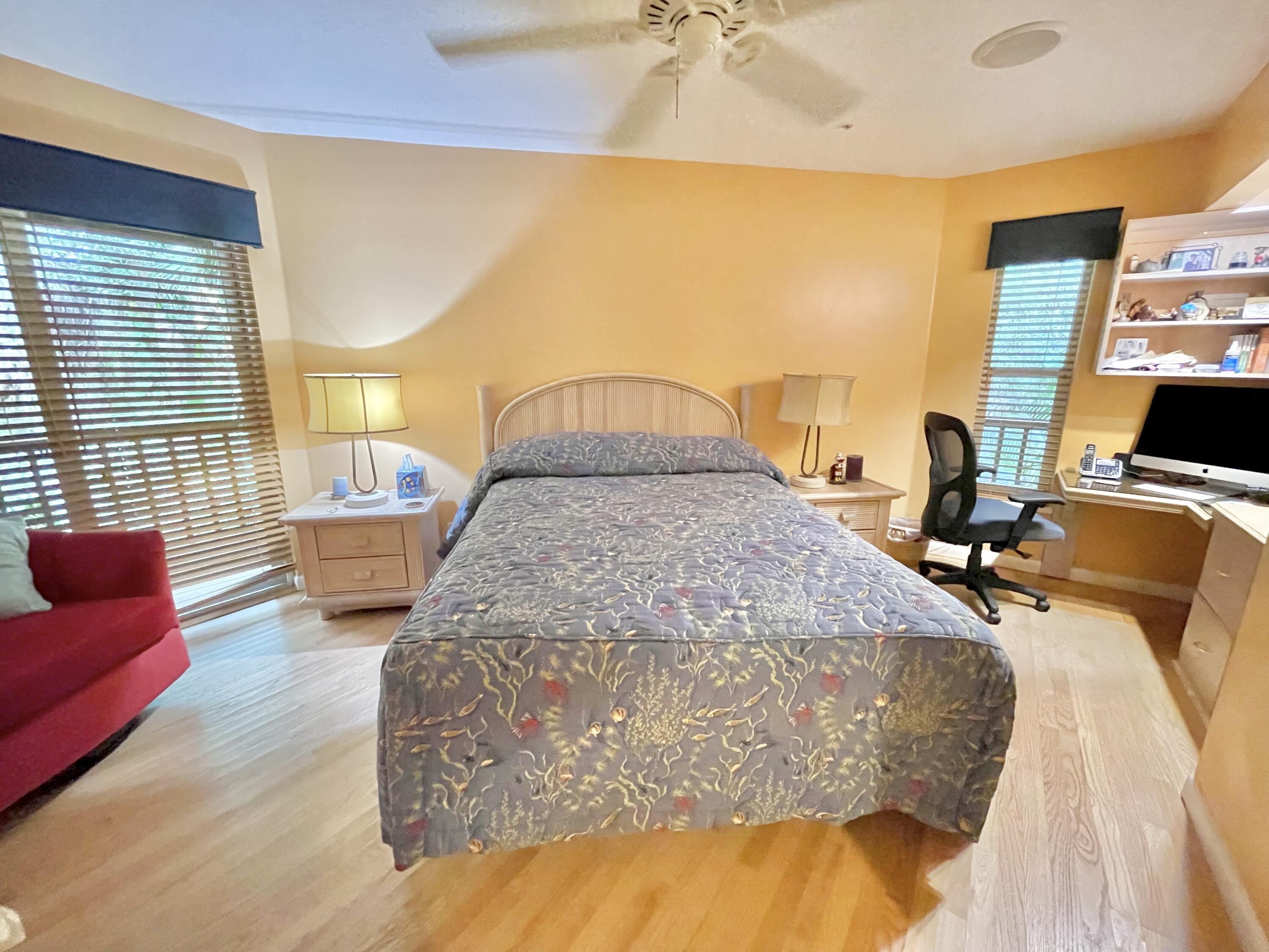 9470 Sandy Run Road Jupiter, FL 33478 - Photo 37 of 48 a bed sitting in a room next to a window