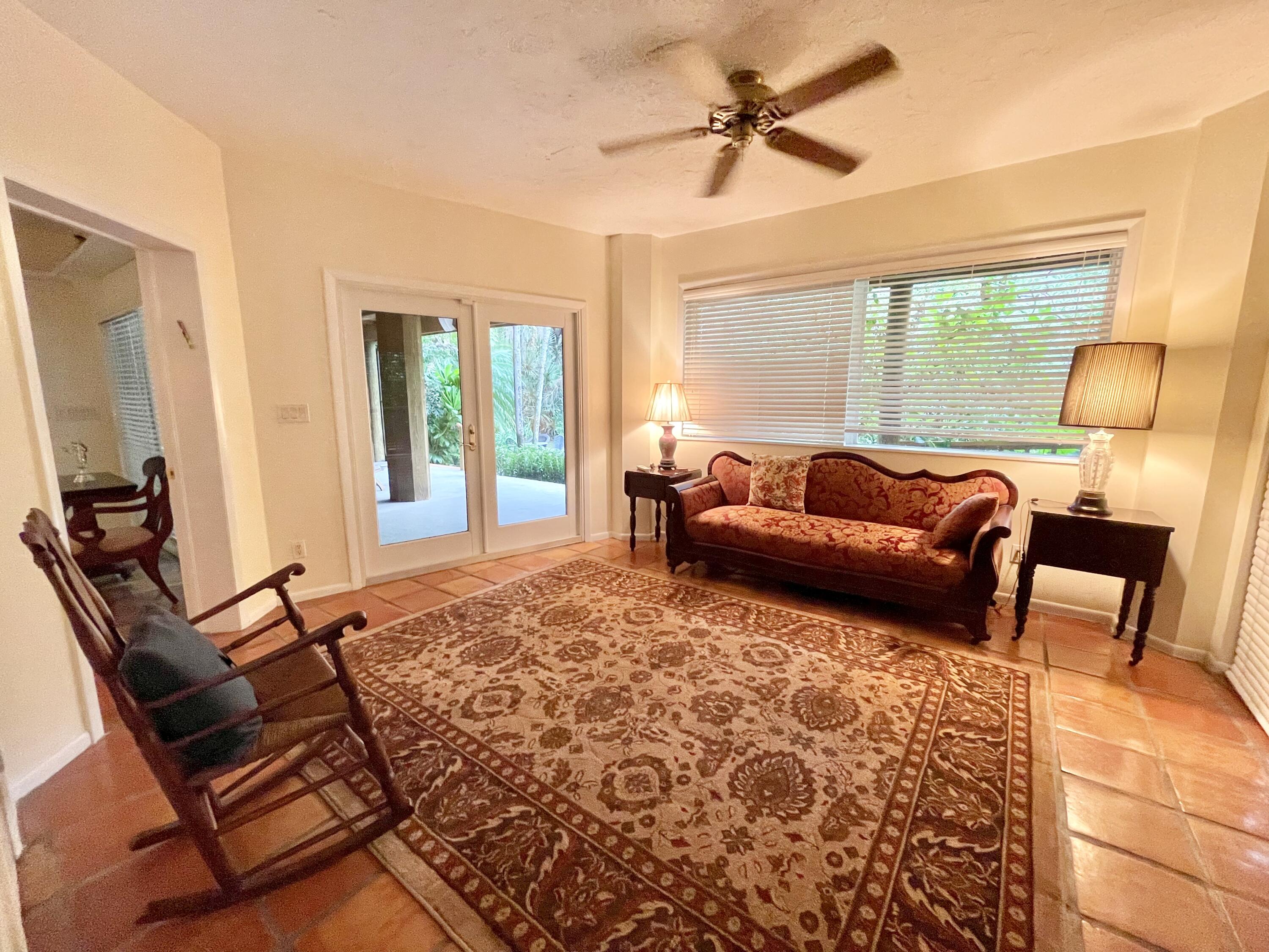 9470 Sandy Run Road Jupiter, FL 33478 - Photo 40 of 48 a living room with furniture and a window