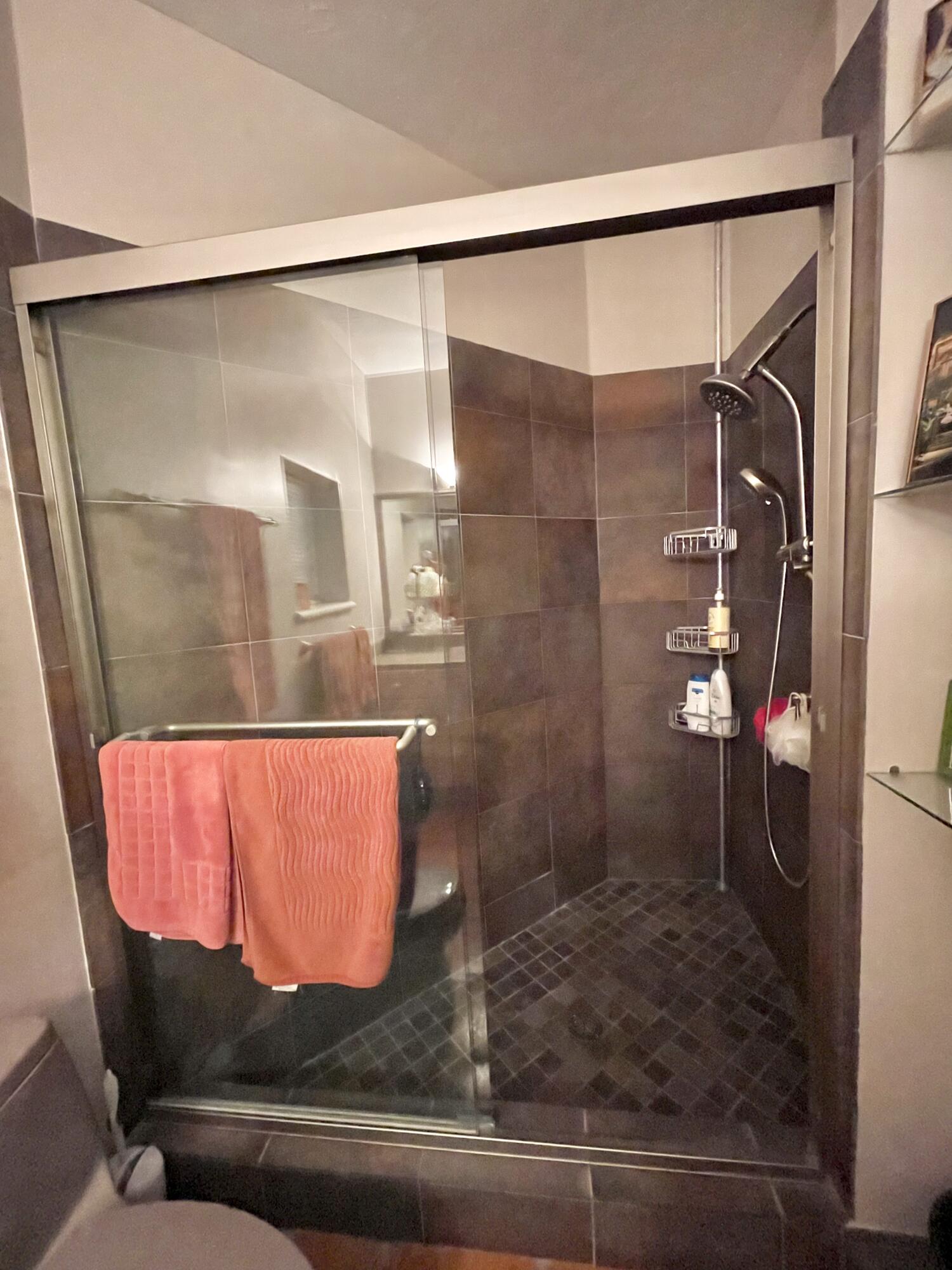 9470 Sandy Run Road Jupiter, FL 33478 - Photo 43 of 48 a bathroom with a shower and a sink