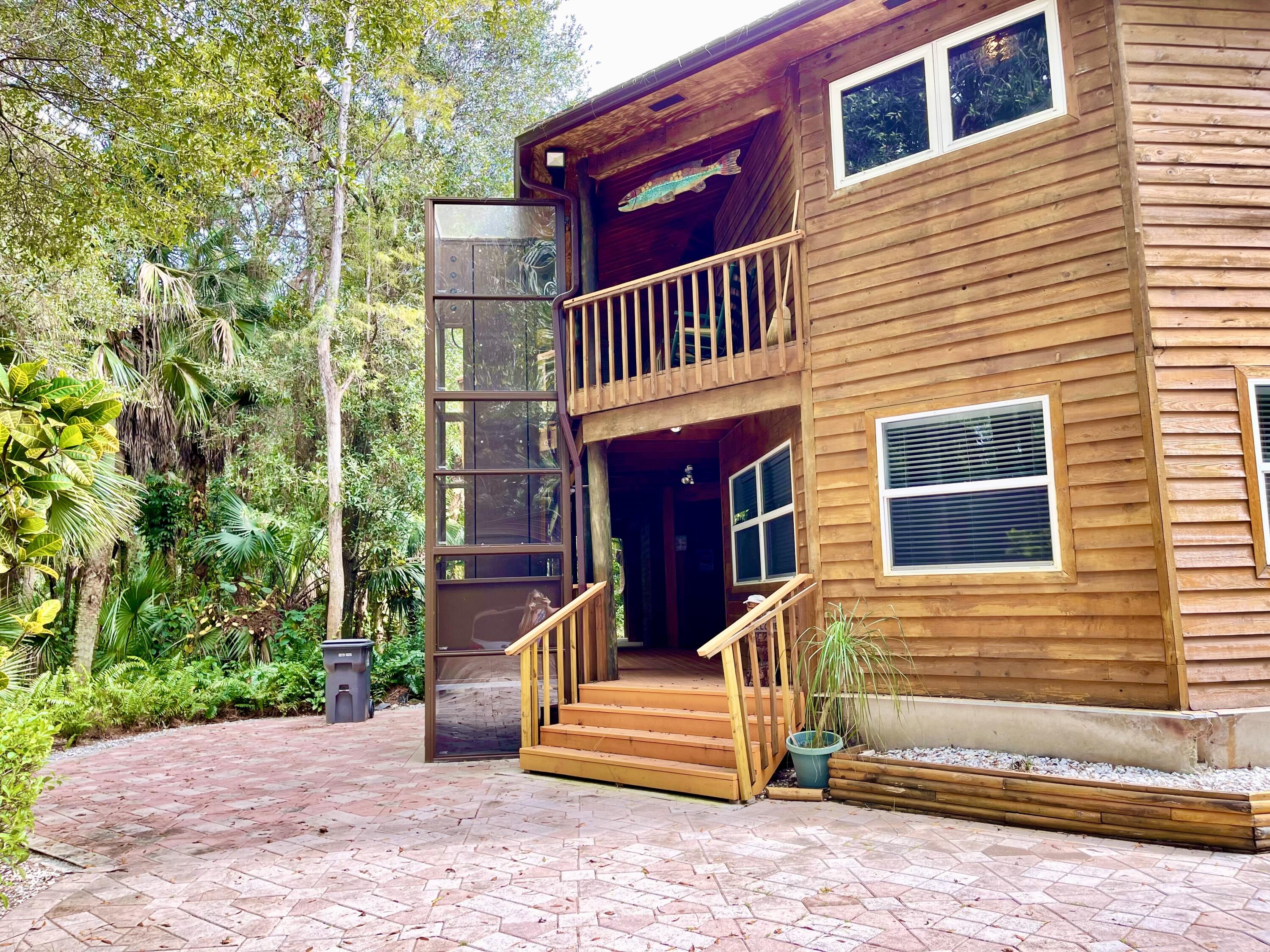 9470 Sandy Run Road Jupiter, FL 33478 - Photo 10 of 48 a front view of a house