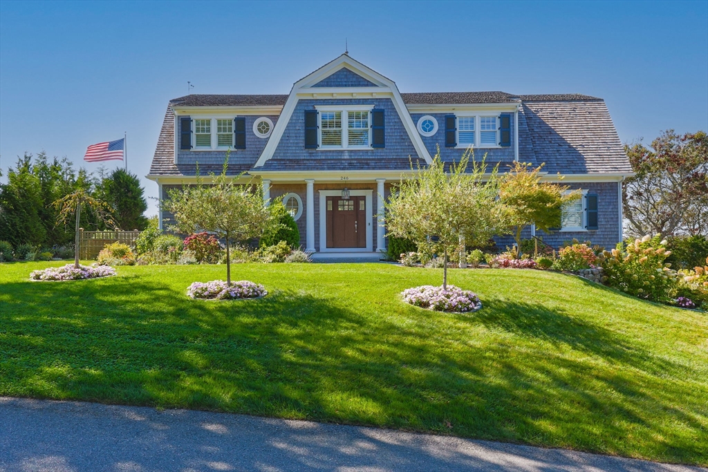 a front view of house with yard and green space