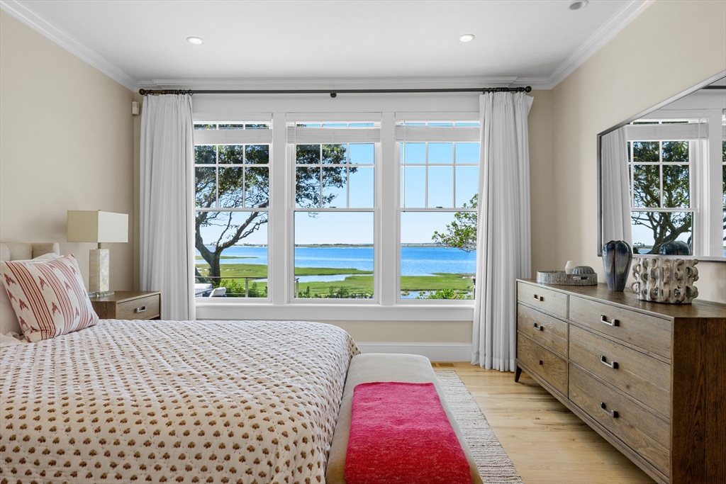 246 Stage Island Road Chatham, MA 02633 - Photo 14 of 37 a bedroom with a large bed and a window