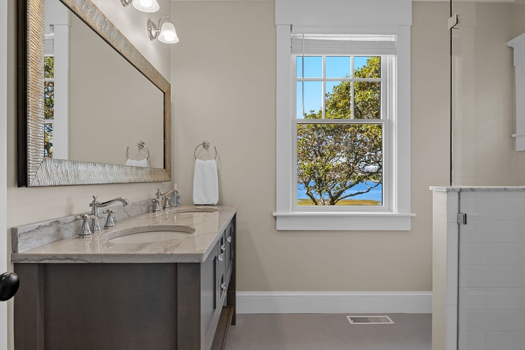 246 Stage Island Road Chatham, MA 02633 - Photo 15 of 37 a bathroom with a sink and a mirror