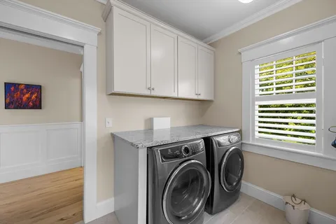 a spacious bedroom with a bed and glass window