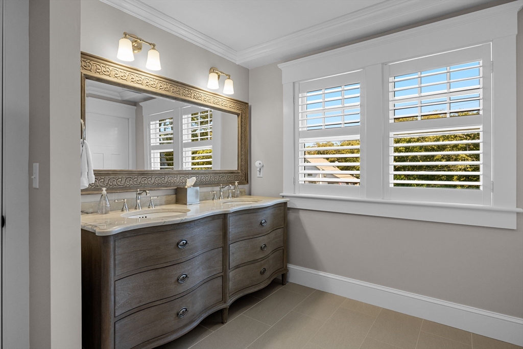 246 Stage Island Road Chatham, MA 02633 - Photo 19 of 37 a bathroom with a granite countertop sink mirror and a window
