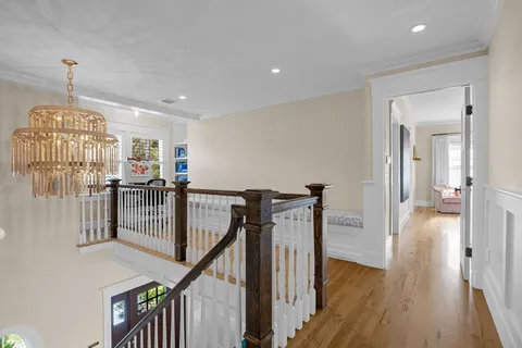 a bed room with a bed couch and a large window